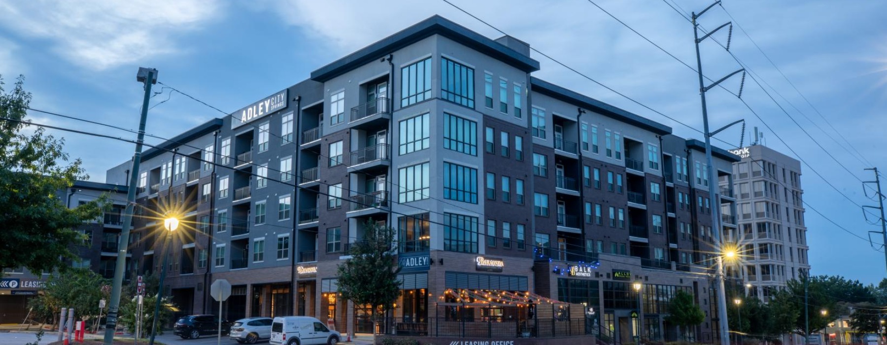 a building with a street and cars